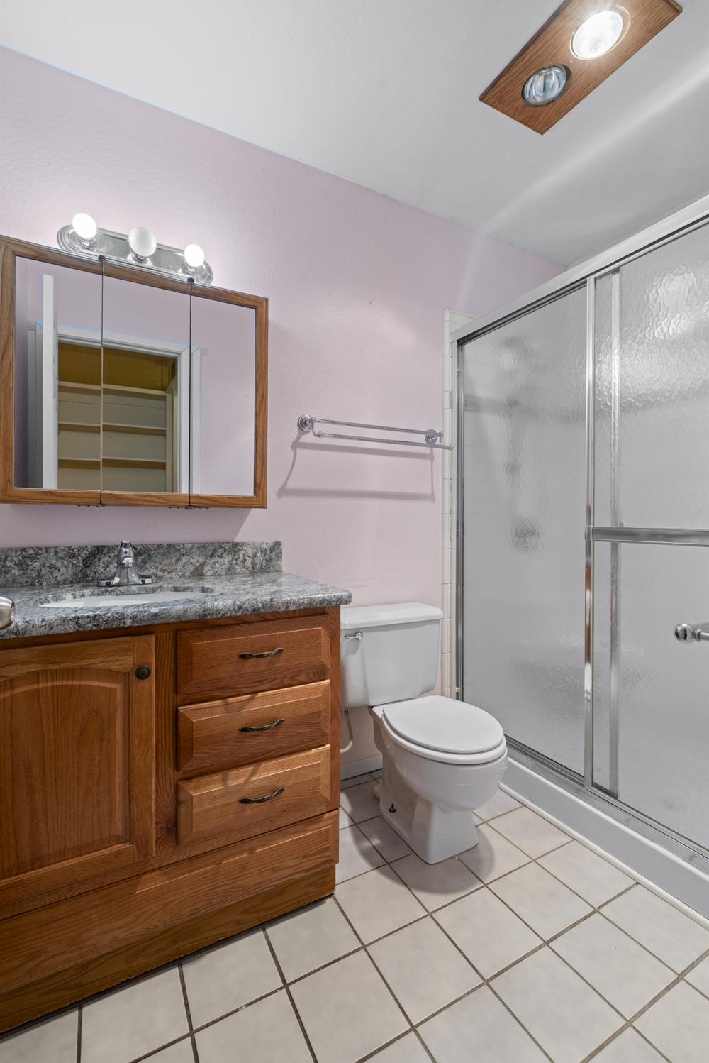 16173 Norlene Way Grass Valley, CA 95949 - Photo 23 of 25 a bathroom with a granite countertop sink toilet and shower