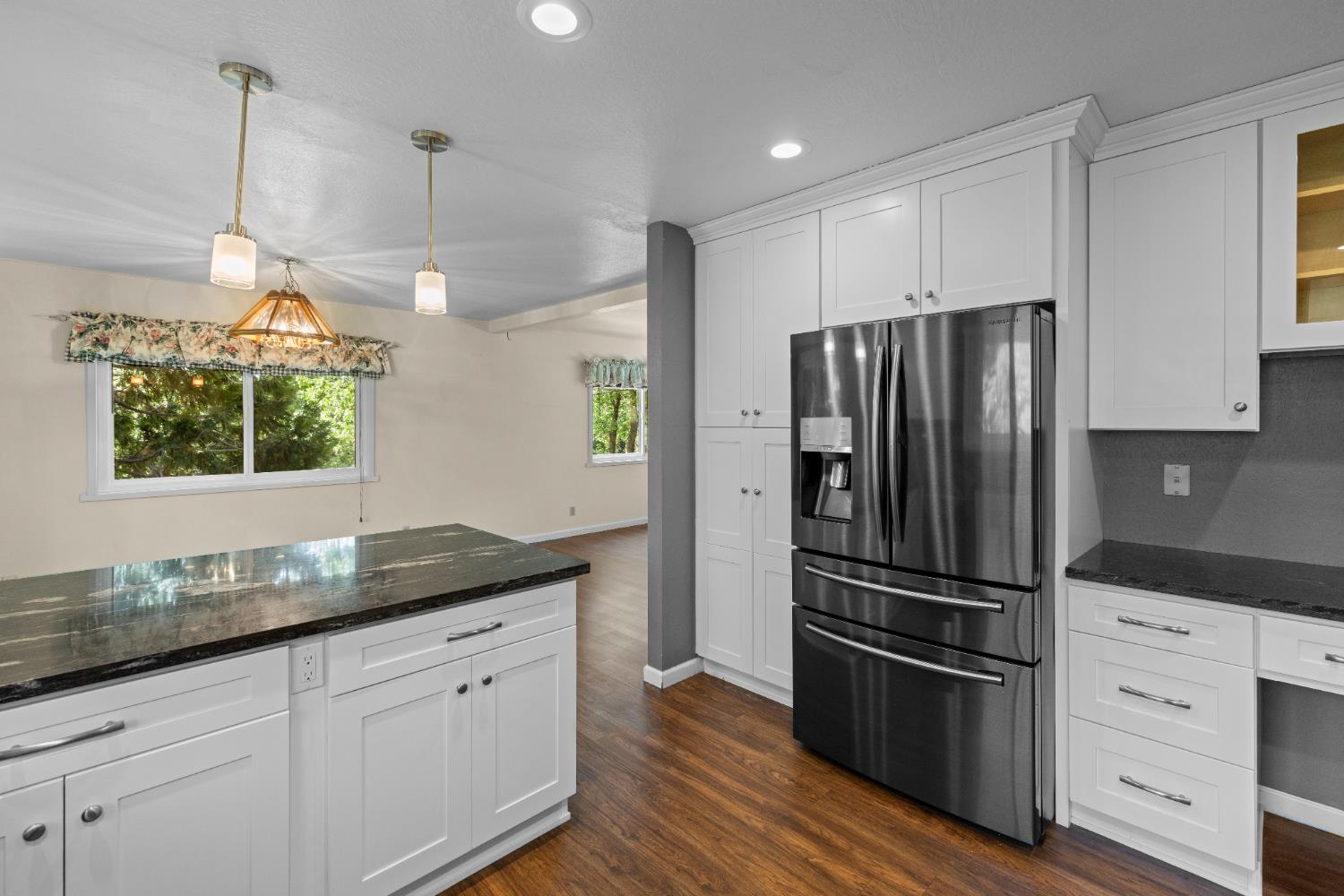16173 Norlene Way Grass Valley, CA 95949 - Photo 7 of 25 a kitchen with granite countertop stainless steel appliances a refrigerator microwave and sink