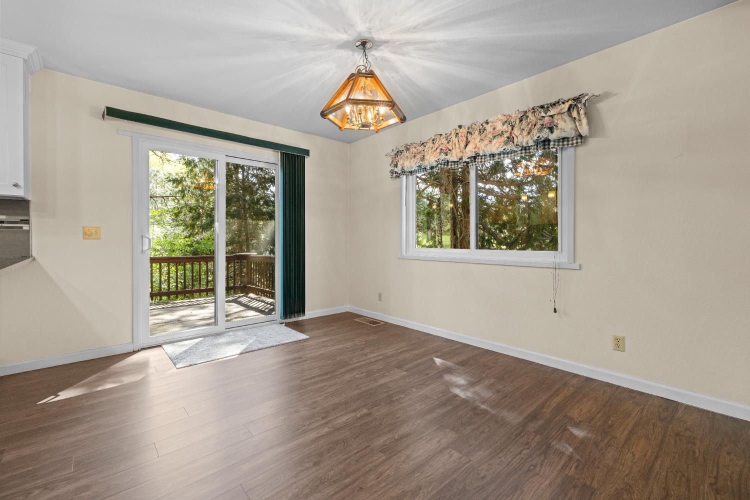 16173 Norlene Way Grass Valley, CA 95949 - Photo 8 of 25 a view of an empty room with wooden floor and a window