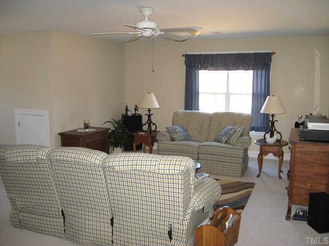 1300 Red Brick Road Garner, NC 27529 - Photo 11 of 12 a bedroom with a bed couch and window