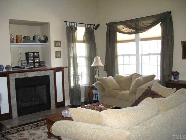 1300 Red Brick Road Garner, NC 27529 - Photo 2 of 12 a living room with furniture and a fireplace