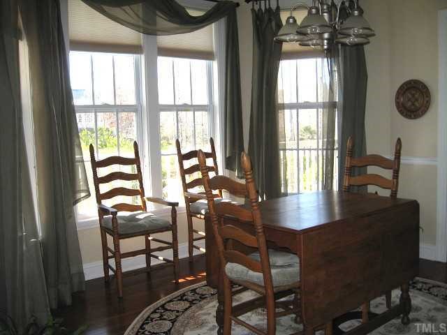 1300 Red Brick Road Garner, NC 27529 - Photo 3 of 12 a view of a dining room with furniture and windows