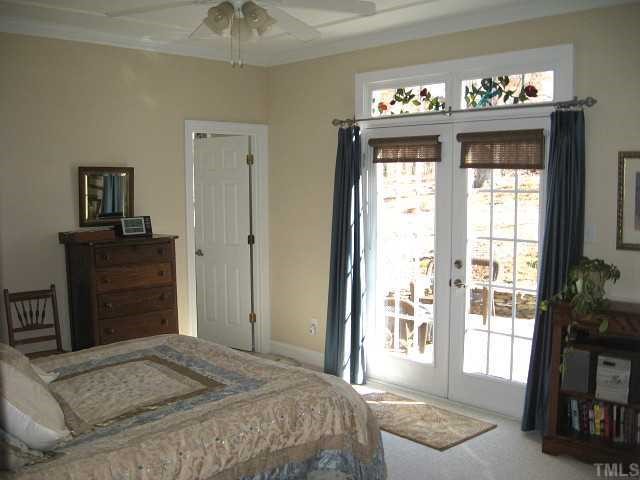 1300 Red Brick Road Garner, NC 27529 - Photo 5 of 12 a bedroom with a bed and a television