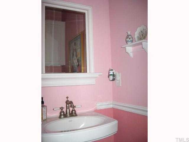 1300 Red Brick Road Garner, NC 27529 - Photo 7 of 12 a bathroom with a sink and a mirror