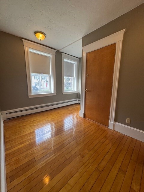 45 Broad Street, Unit 2 Salem, MA 01970 - Photo 7 of 16 a view of an empty room with wooden floor and a window