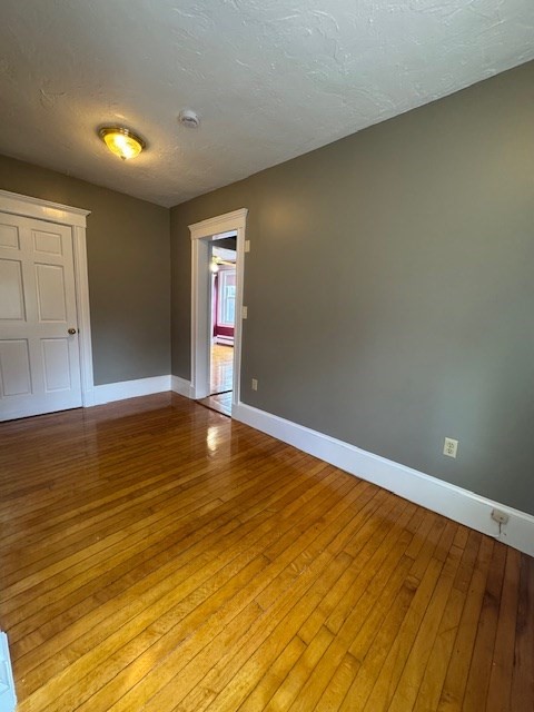 45 Broad Street, Unit 2 Salem, MA 01970 - Photo 8 of 16 a view of empty room with wooden floor
