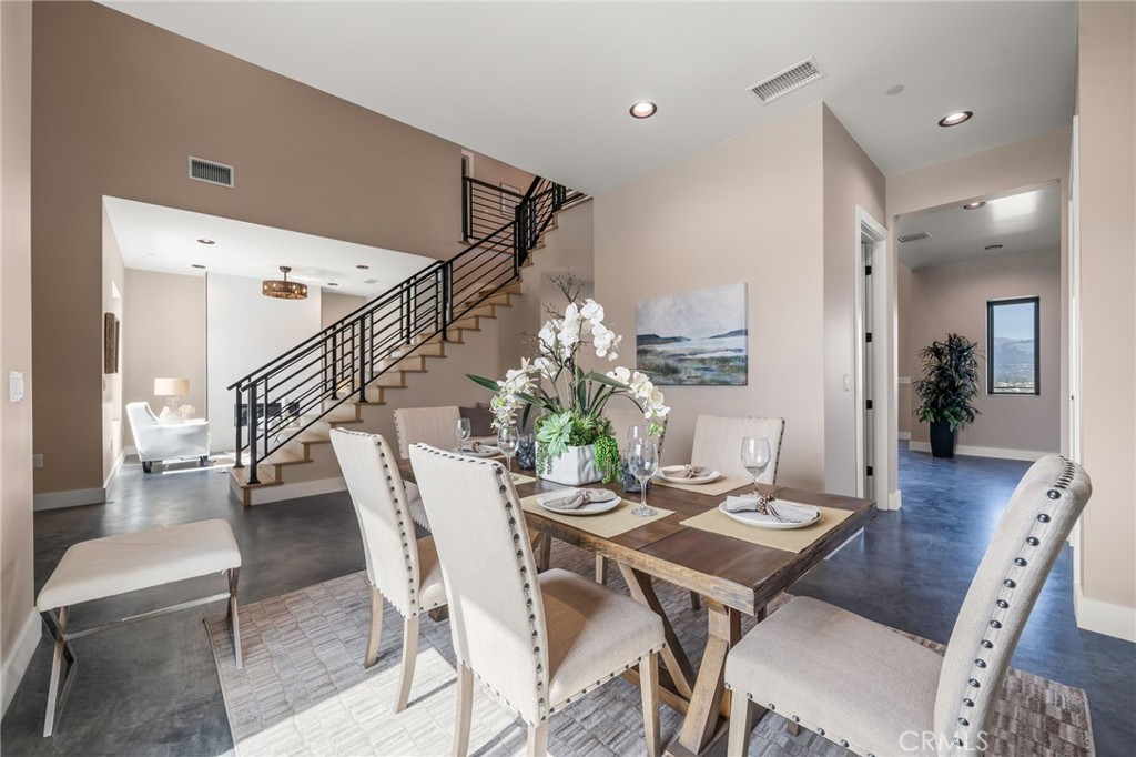 2380 Scenic Ridge Drive Chino Hills, CA 91709 - Photo 13 of 67 a dining room with furniture a rug and wooden floor