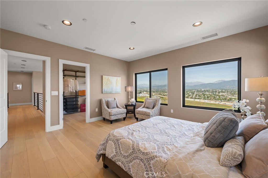 2380 Scenic Ridge Drive Chino Hills, CA 91709 - Photo 37 of 67 a bedroom with a large bed and a couch