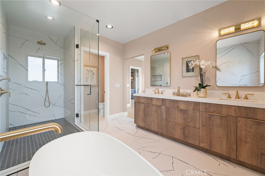 2380 Scenic Ridge Drive Chino Hills, CA 91709 - Photo 40 of 67 a spacious bathroom with double vanity a sink a mirror a bathtub and shower