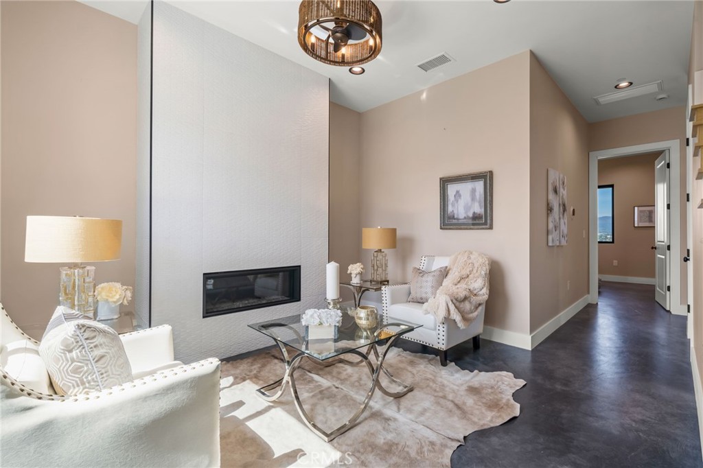 2380 Scenic Ridge Drive Chino Hills, CA 91709 - Photo 8 of 67 a living room with furniture and a flat screen tv