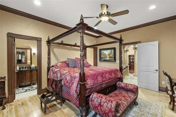 a bed room with a bed and a mirror