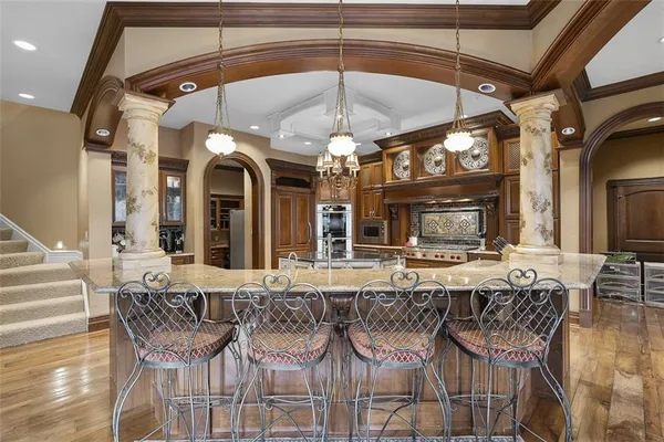 a view of a dining room with furniture and chandelier