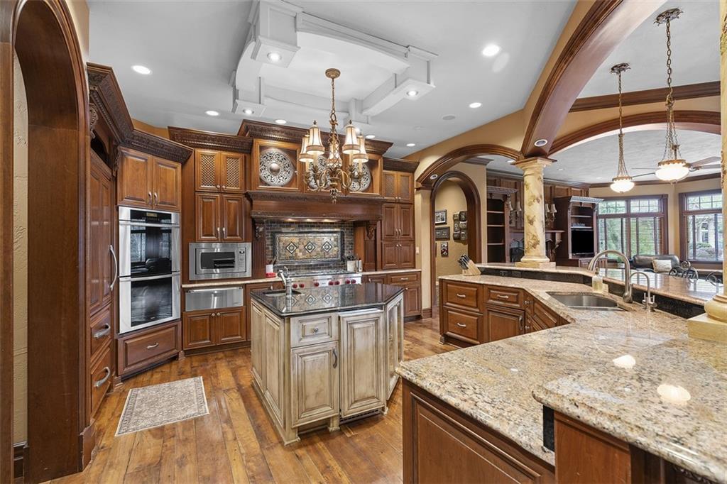 262 Justabout Road Venetia, PA 15367 - Photo 14 of 49 a kitchen with stainless steel appliances granite countertop a sink a stove and a refrigerator