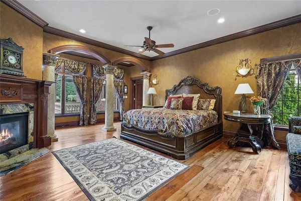 a bedroom with a bed a table and chair