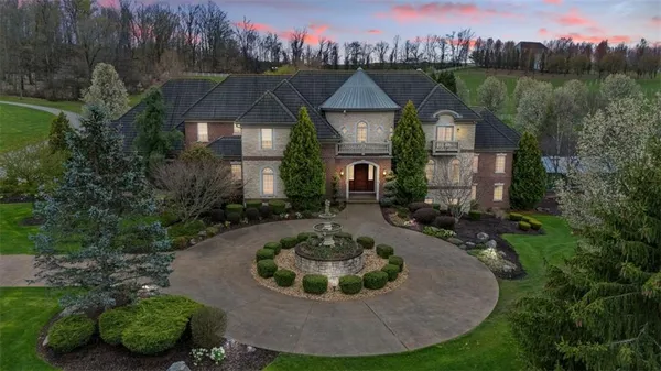 a view of a house with a yard and a tub