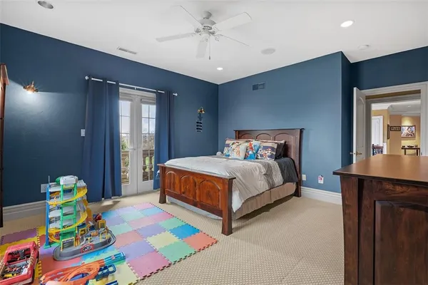 a bedroom with a bed and a dresser in it