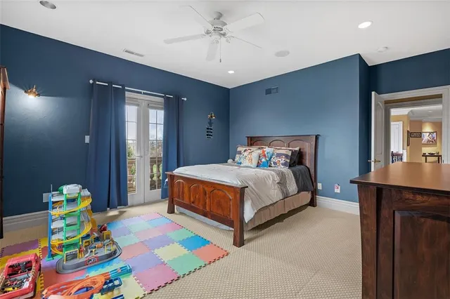 a bedroom with a bed and a dresser in it