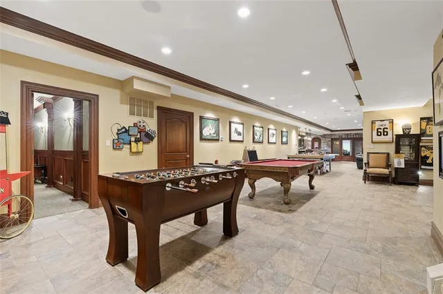 a living room with furniture a table and gym equipment
