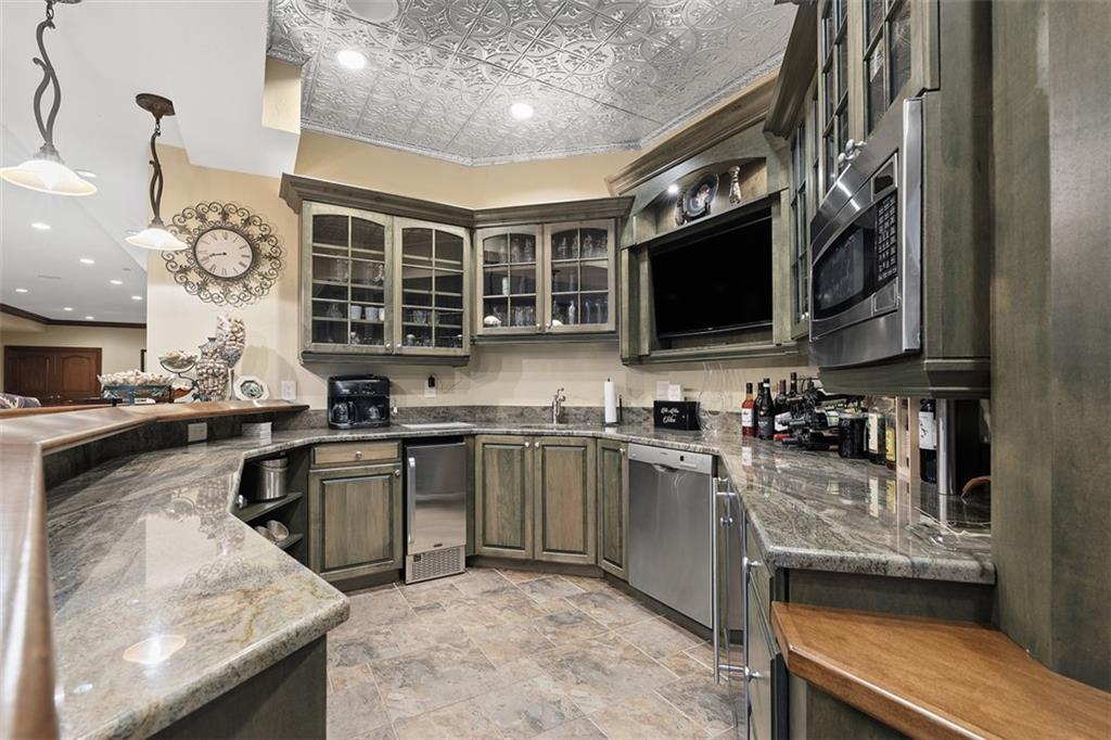 262 Justabout Road Venetia, PA 15367 - Photo 30 of 49 a kitchen with stainless steel appliances granite countertop a sink stove microwave and cabinets