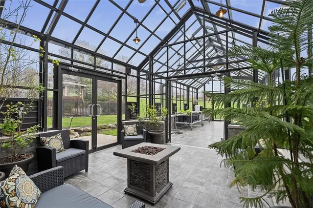 a building outdoor space with patio furniture and potted plants