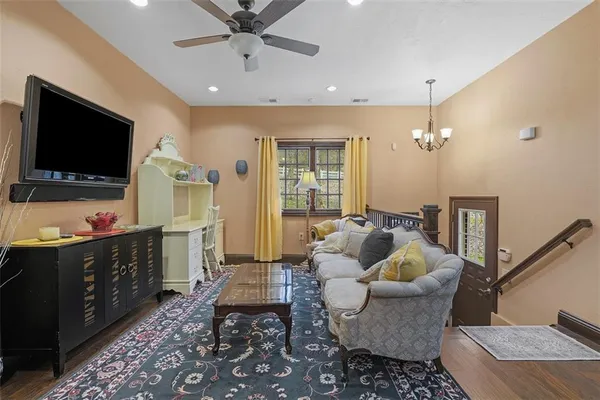 a living room with furniture and a flat screen tv