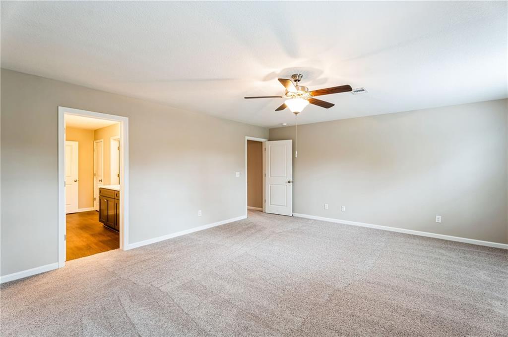 23 Whiterock Road Phenix City, AL 36869 - Photo 18 of 29 Unfurnished room with visible vents, baseboards, carpet, and ceiling fan
