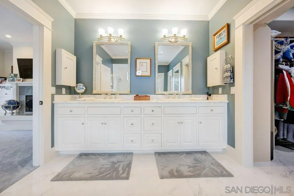 603 J Avenue Coronado, CA 92118 - Photo 13 of 22 a spacious bathroom with a granite countertop sink and a mirror