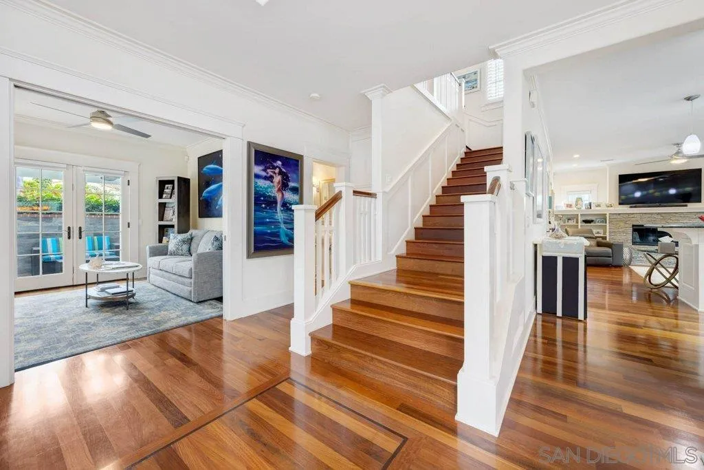 603 J Avenue Coronado, CA 92118 - Photo 4 of 22 a living room with furniture and a dining table with wooden floor