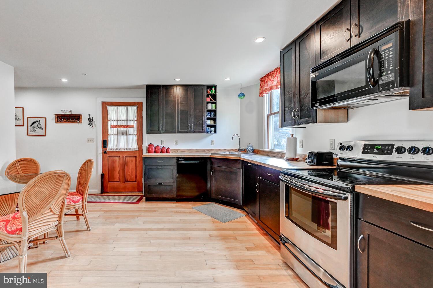 1911 Monkton Road Monkton, MD 21111 - Photo 14 of 35 a kitchen with stainless steel appliances granite countertop a stove and a microwave