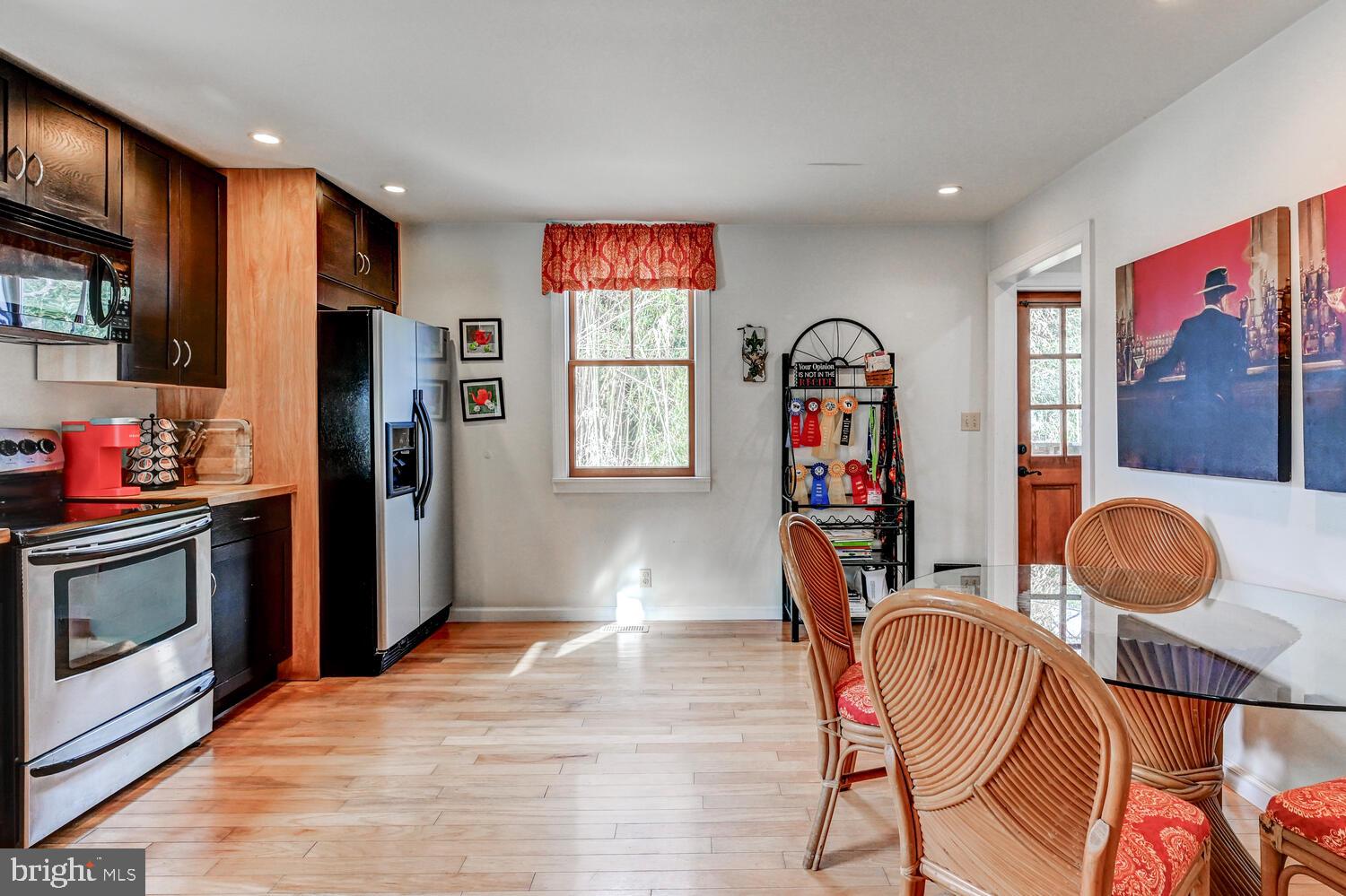 1911 Monkton Road Monkton, MD 21111 - Photo 16 of 35 a view of a kitchen with fridge and wooden floor