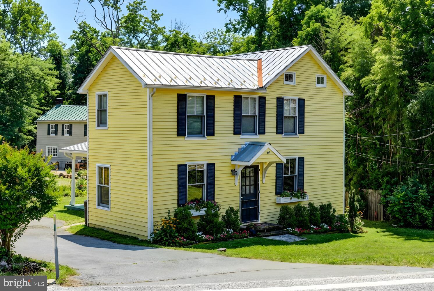 1911 Monkton Road Monkton, MD 21111 - Photo 2 of 35 a front view of a house with a yard and garage