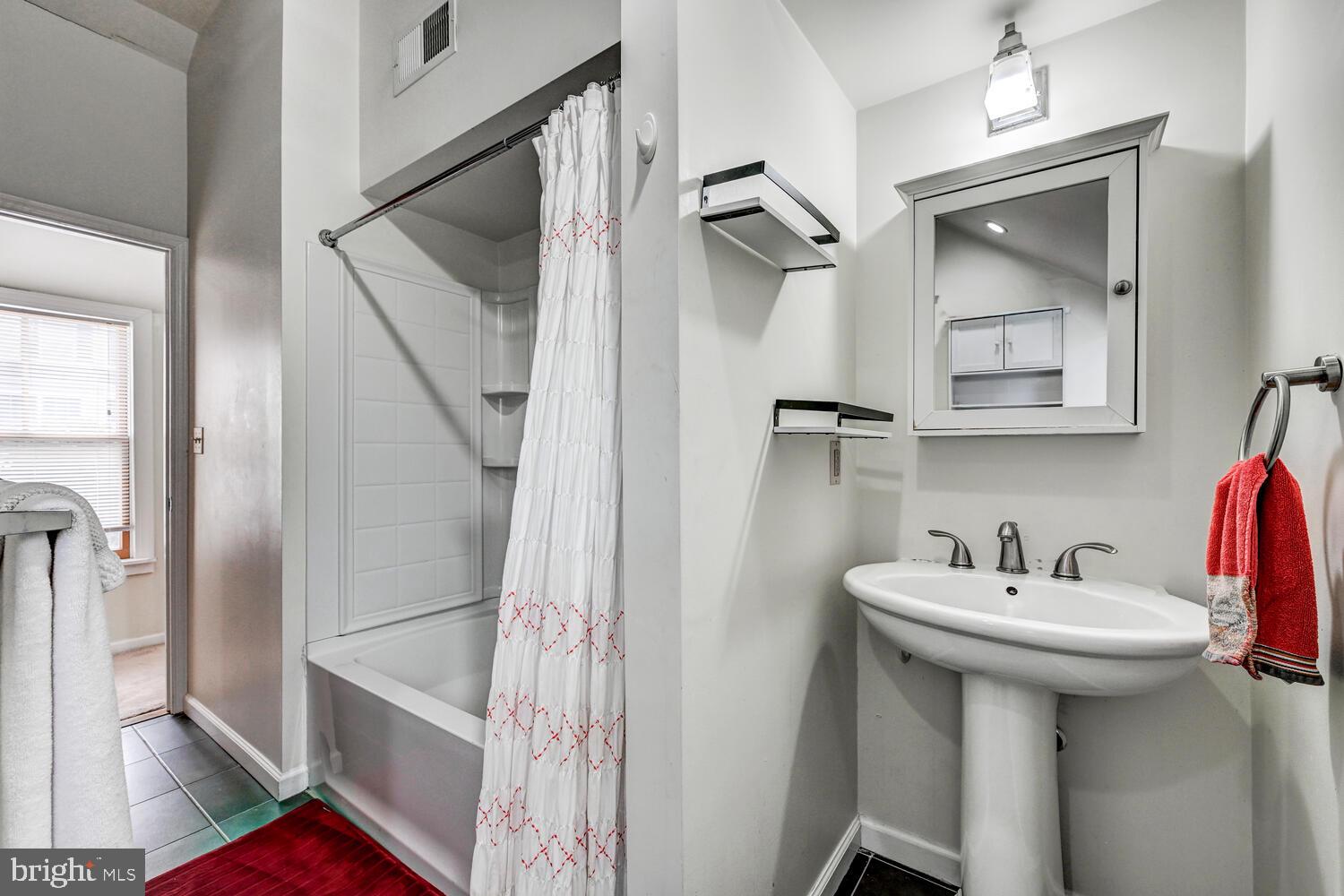 1911 Monkton Road Monkton, MD 21111 - Photo 23 of 35 a bathroom with a sink and mirror