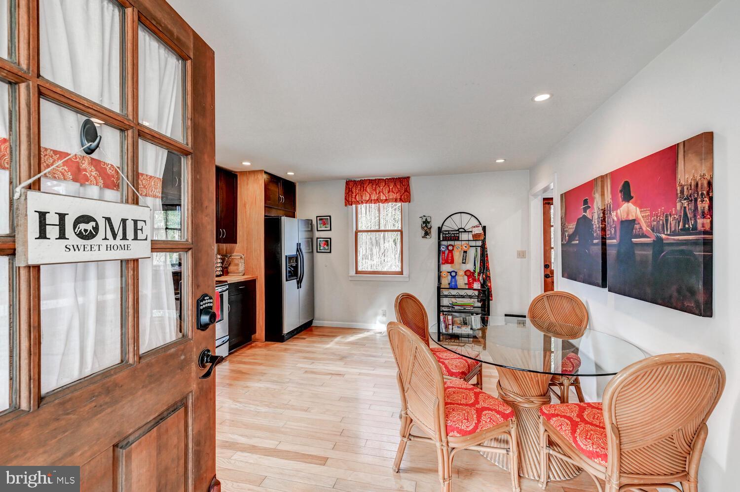 1911 Monkton Road Monkton, MD 21111 - Photo 24 of 35 a living room with furniture a flat screen tv and a book shelf