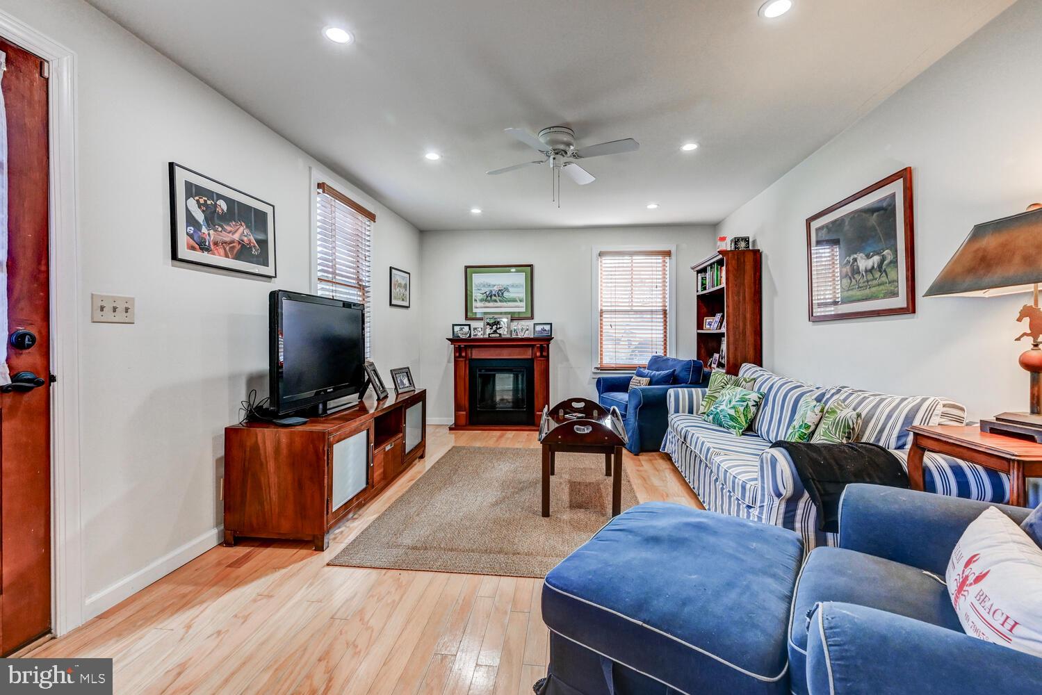 1911 Monkton Road Monkton, MD 21111 - Photo 8 of 35 a living room with furniture a flat screen tv and a fireplace