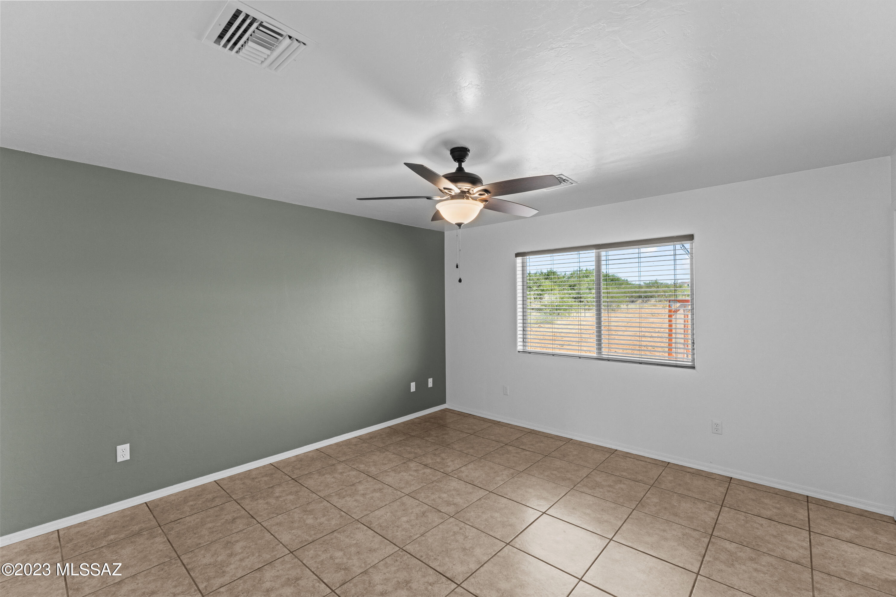 1615 Tonina Court Rio Rico, AZ 85648 - Photo 19 of 28 a view of an empty room with a window