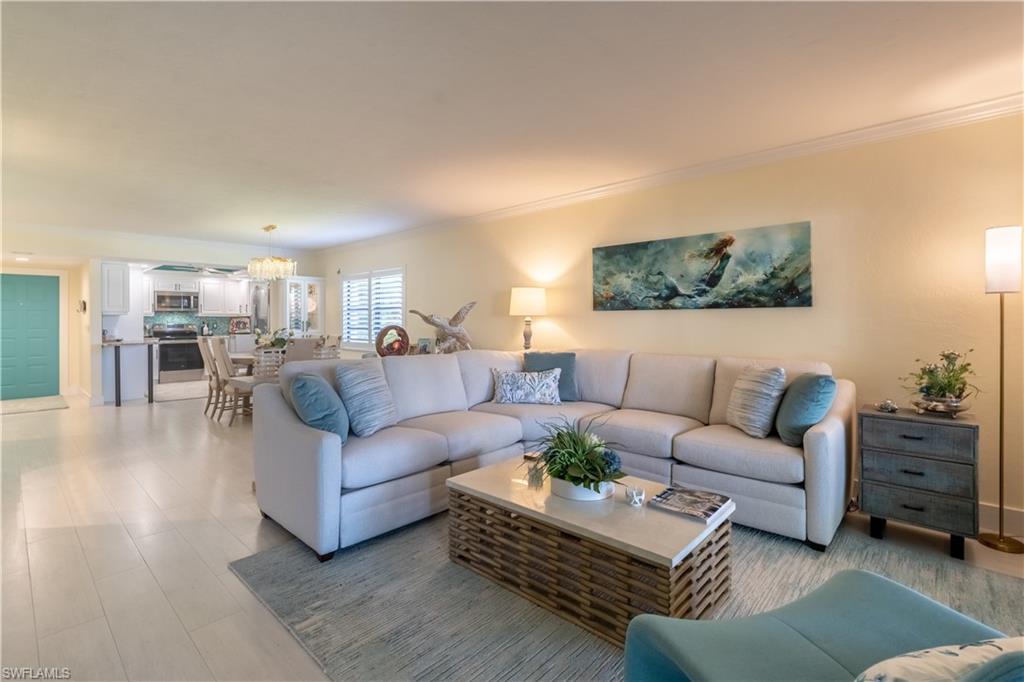 a living room with furniture or couch and a flat screen tv