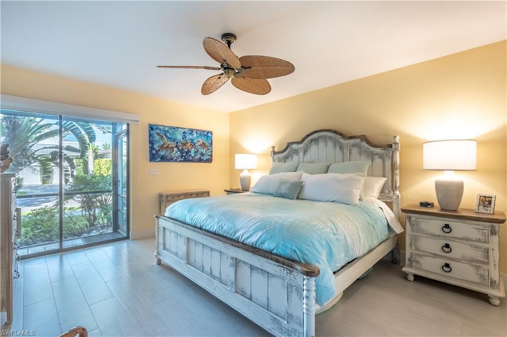 1071 8th Street South, Unit 103 Naples, FL 34102 - Photo 14 of 31 a bedroom with a bed a window and closet