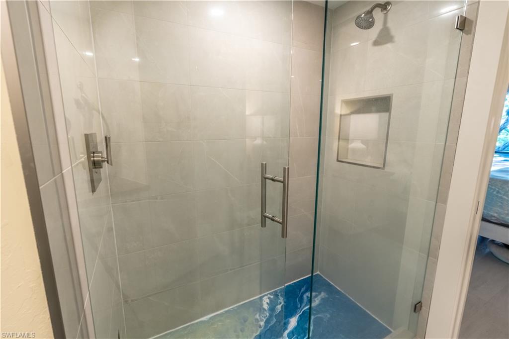 1071 8th Street South, Unit 103 Naples, FL 34102 - Photo 17 of 31 a bathroom with a shower