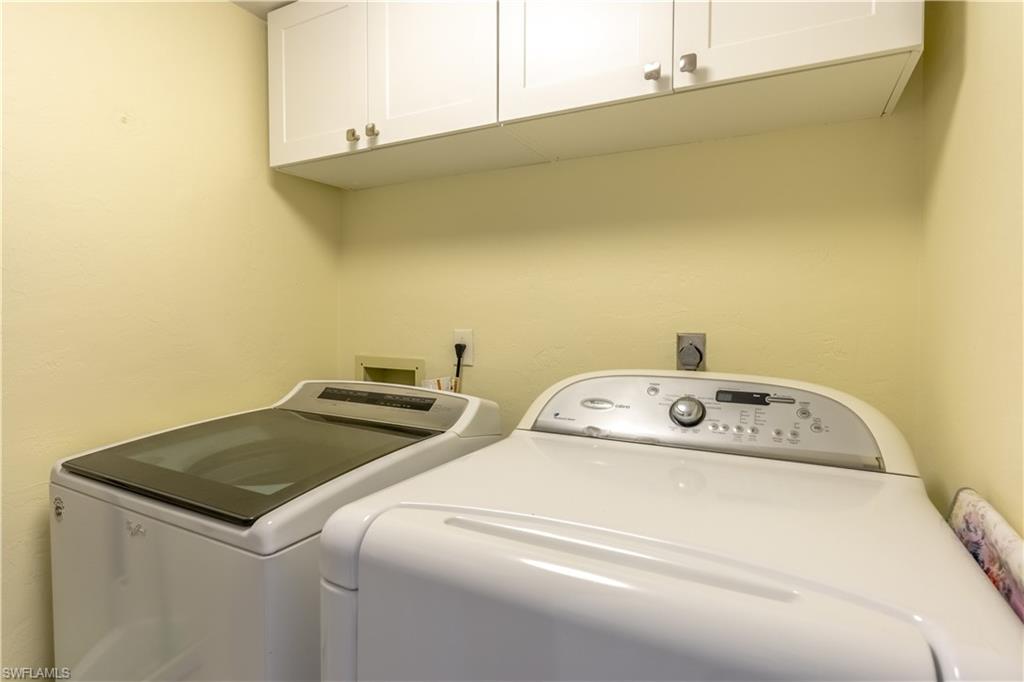 1071 8th Street South, Unit 103 Naples, FL 34102 - Photo 22 of 31 a utility room with dryer and washer