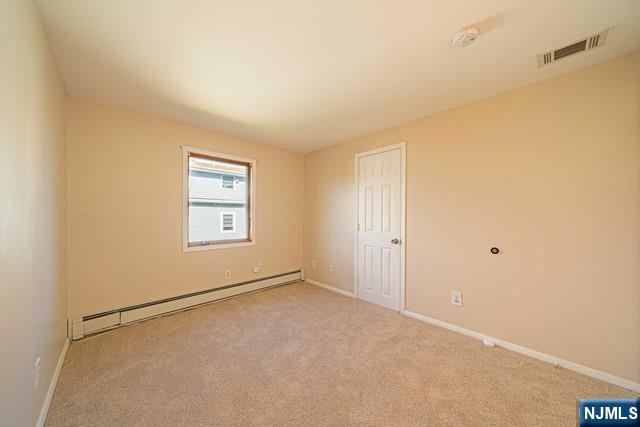 112 Prospect Street, Unit 2 Garfield, NJ 07026 - Photo 11 of 14 a view of an empty room with a window