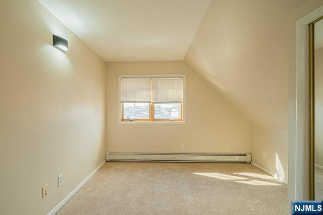 112 Prospect Street, Unit 2 Garfield, NJ 07026 - Photo 13 of 14 an empty room with a empty space and a window
