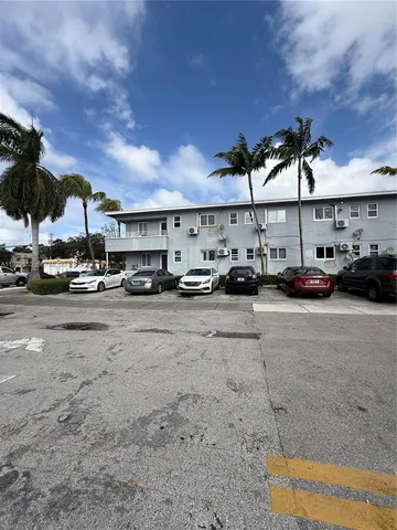 a view of parking with cars parked