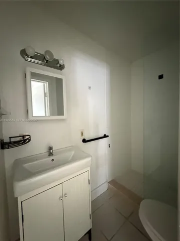 a bathroom with a sink toilet and vanity