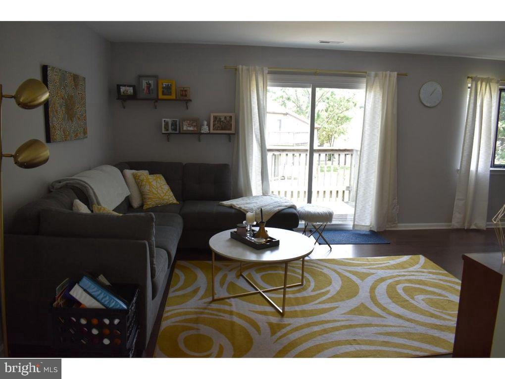 33 Buttonwood Road Voorhees, NJ 08043 - Photo 13 of 14 a living room with furniture and a window