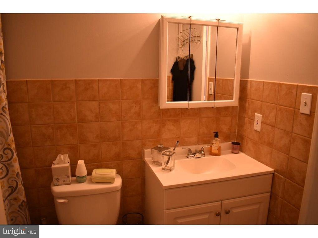 33 Buttonwood Road Voorhees, NJ 08043 - Photo 2 of 14 a bathroom with a sink toilet and mirror