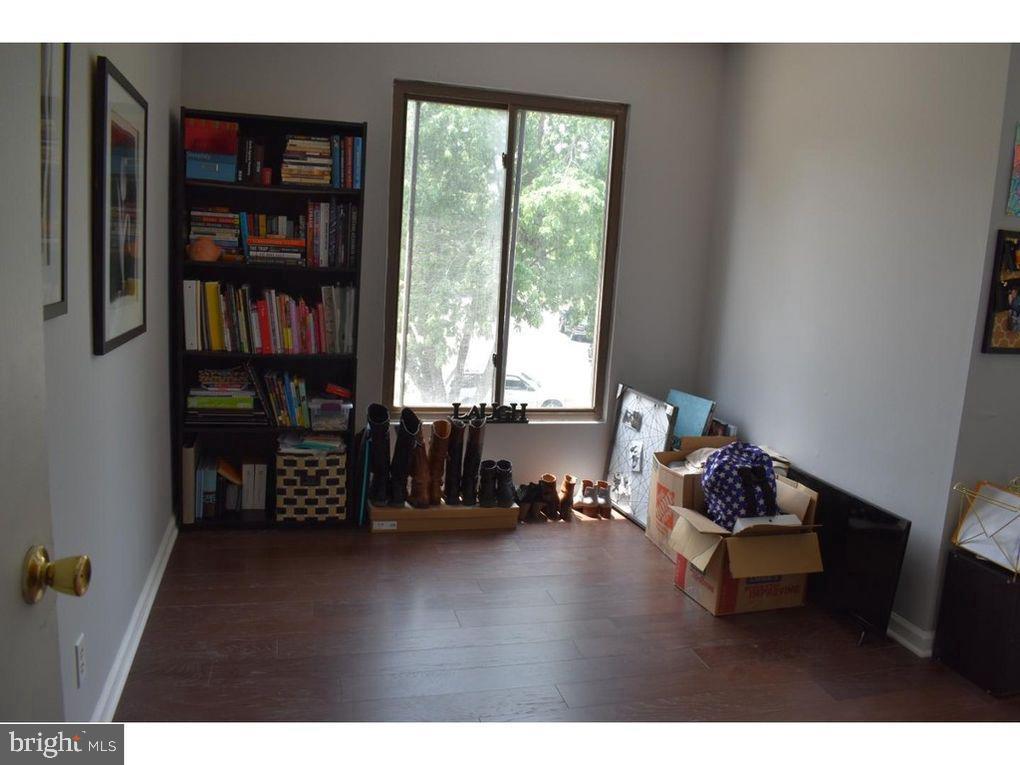 33 Buttonwood Road Voorhees, NJ 08043 - Photo 9 of 14 a living room with furniture a bookshelf and a window