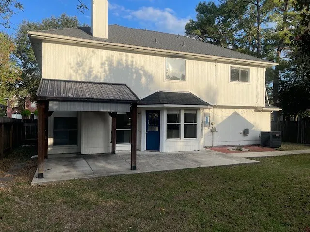 a view of a house with backyard porch and garden