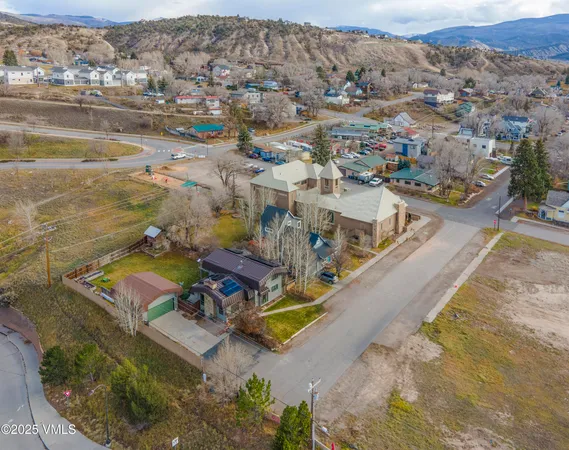 an aerial view of a house with a ocean view