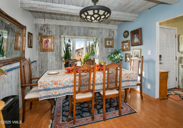 a view of a dining room with furniture window and wooden floor
