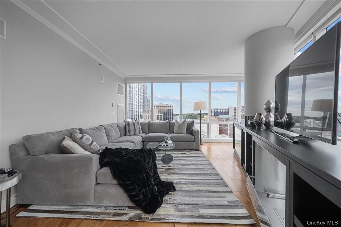 1 Renaissance Square, Unit 14D White Plains, NY 10601 - Photo 12 of 24 a living room with furniture and a large window